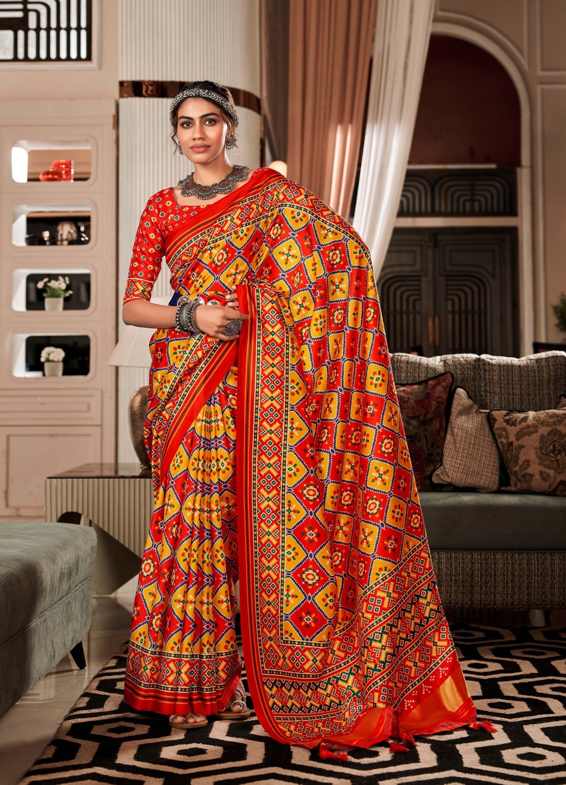 Sunset Symphony Dual Tone Yellow and Red Printed Patola Saree