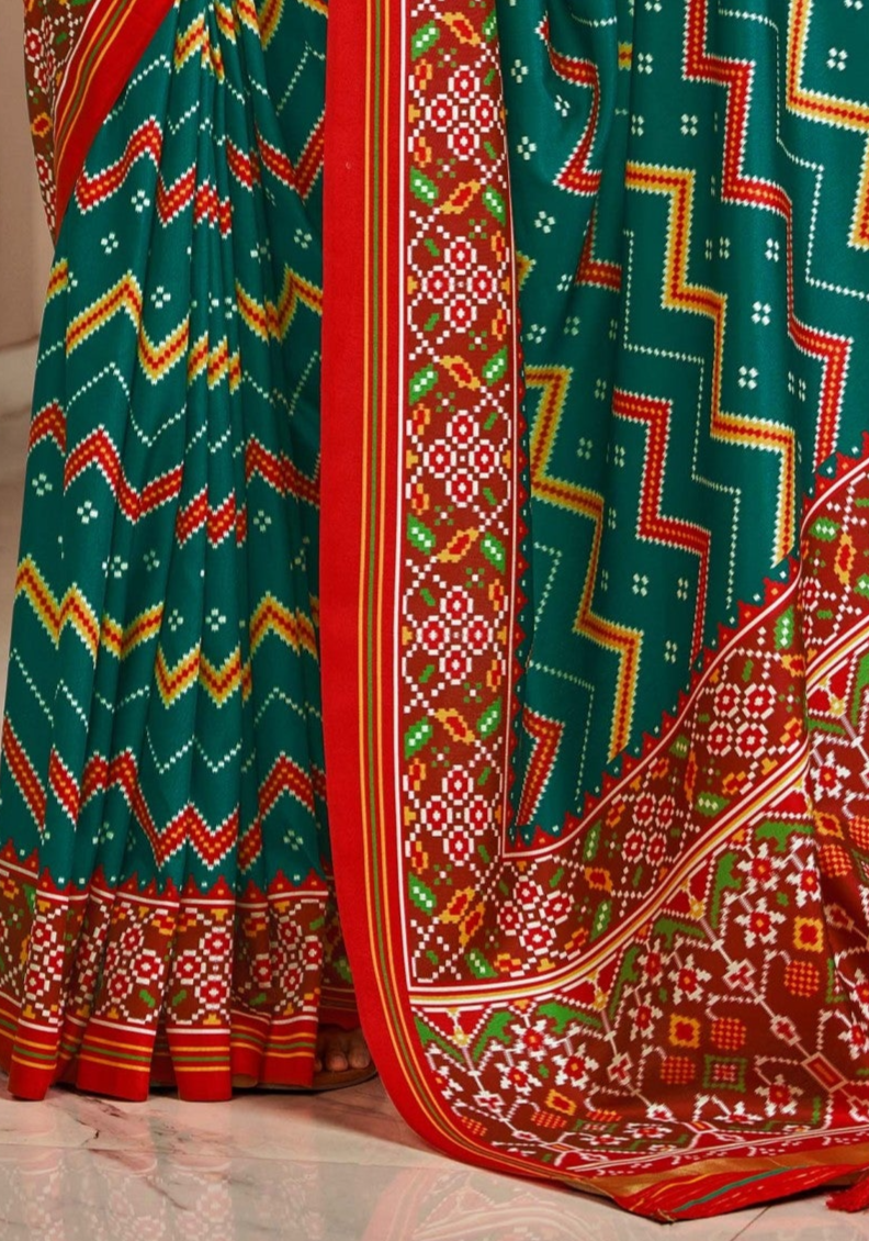 Vibrant Dual Tone Green and Red Printed Patola Silk Saree