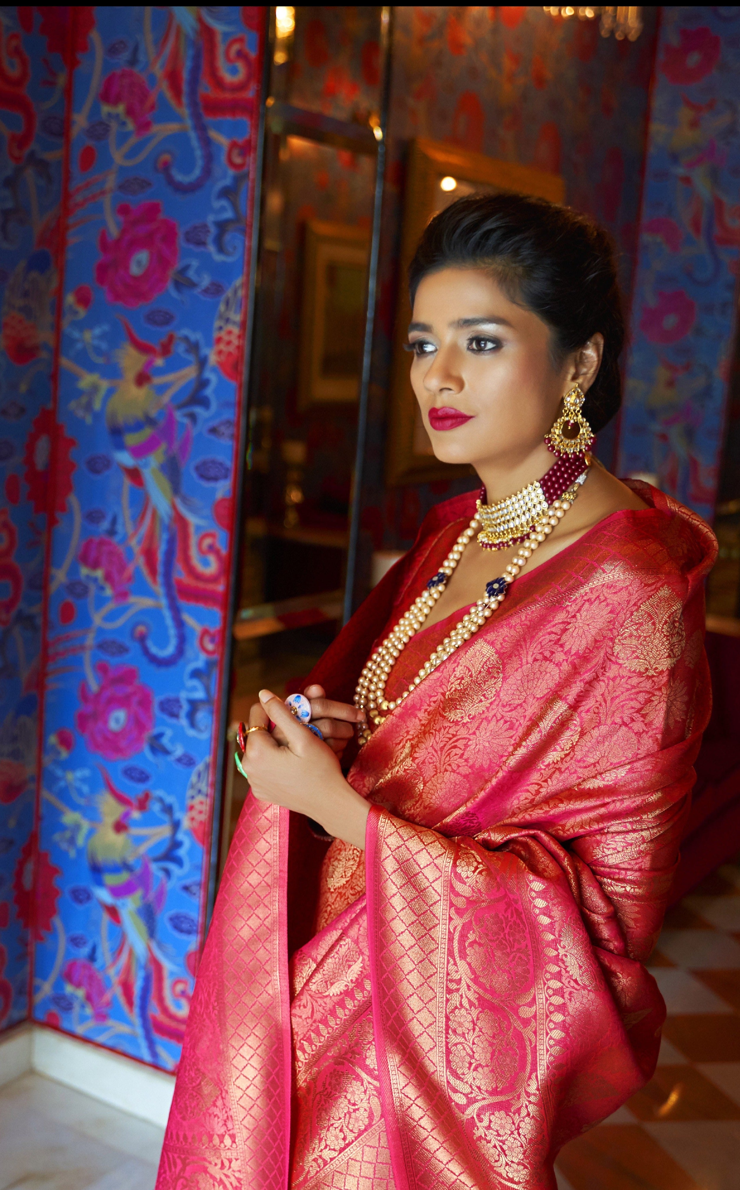 Golden red hue Zari woven Kanjivaram saree