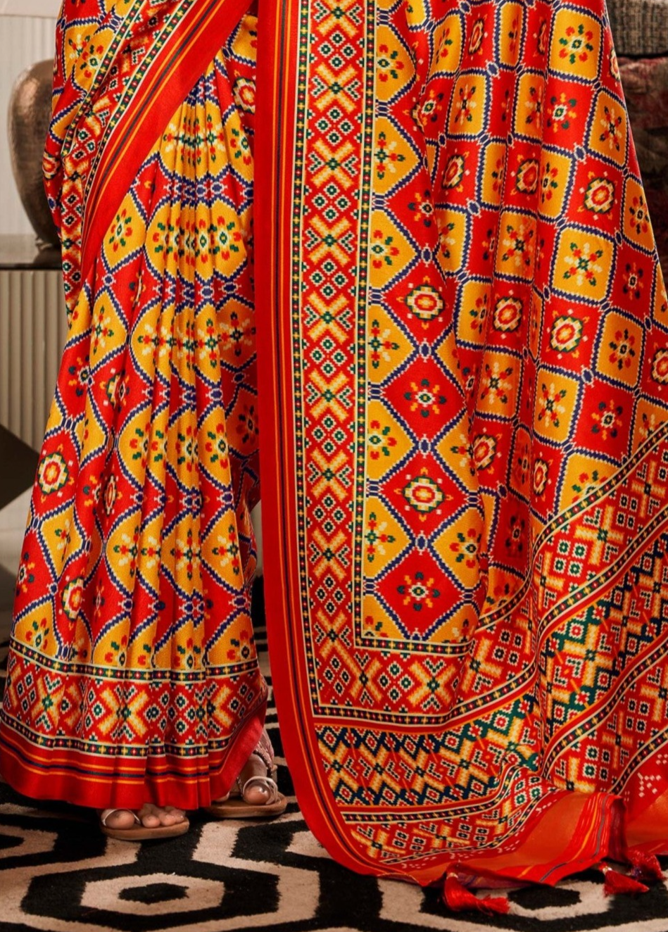 Sunset Symphony Dual Tone Yellow and Red Printed Patola Saree